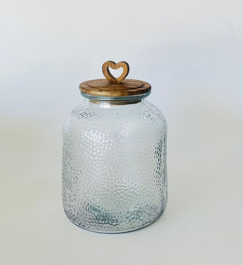 Bote de cristal y acacia con corazón